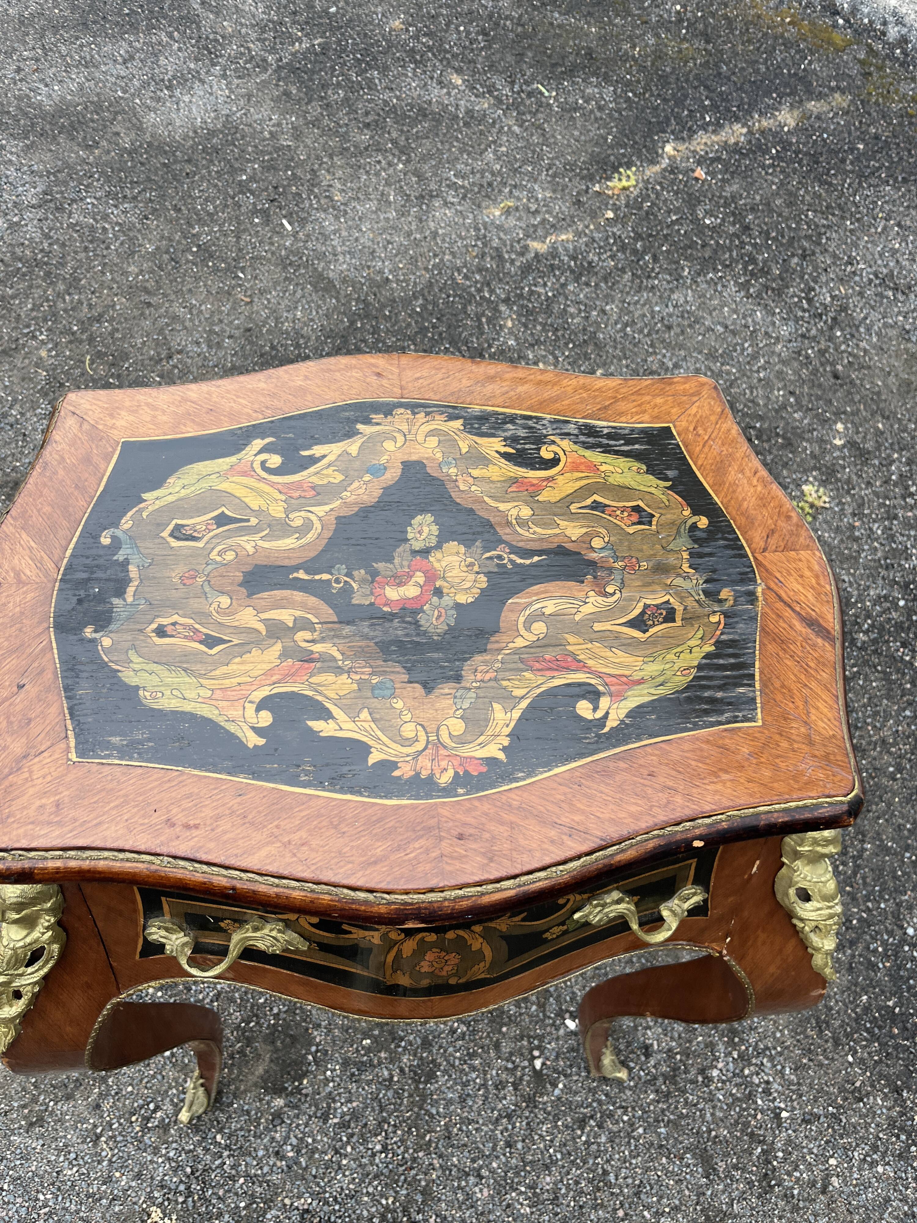 Louis XV style side table with marquetry and gilded bronze.