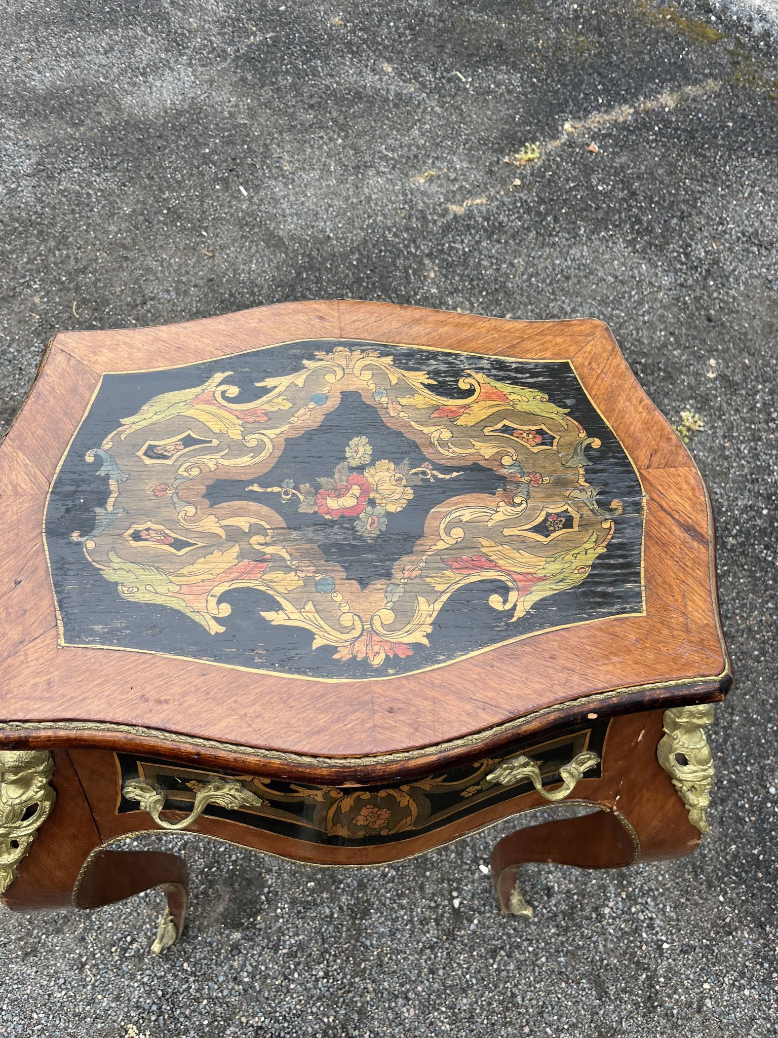 Louis XV style side table with marquetry and gilded bronze.
