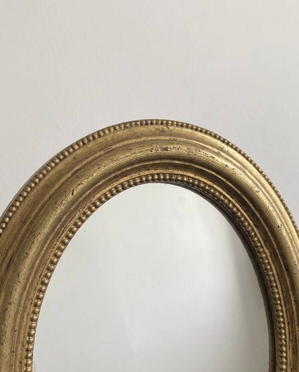 Miroir ancien ovale doré style Louis XVI -belle patine
