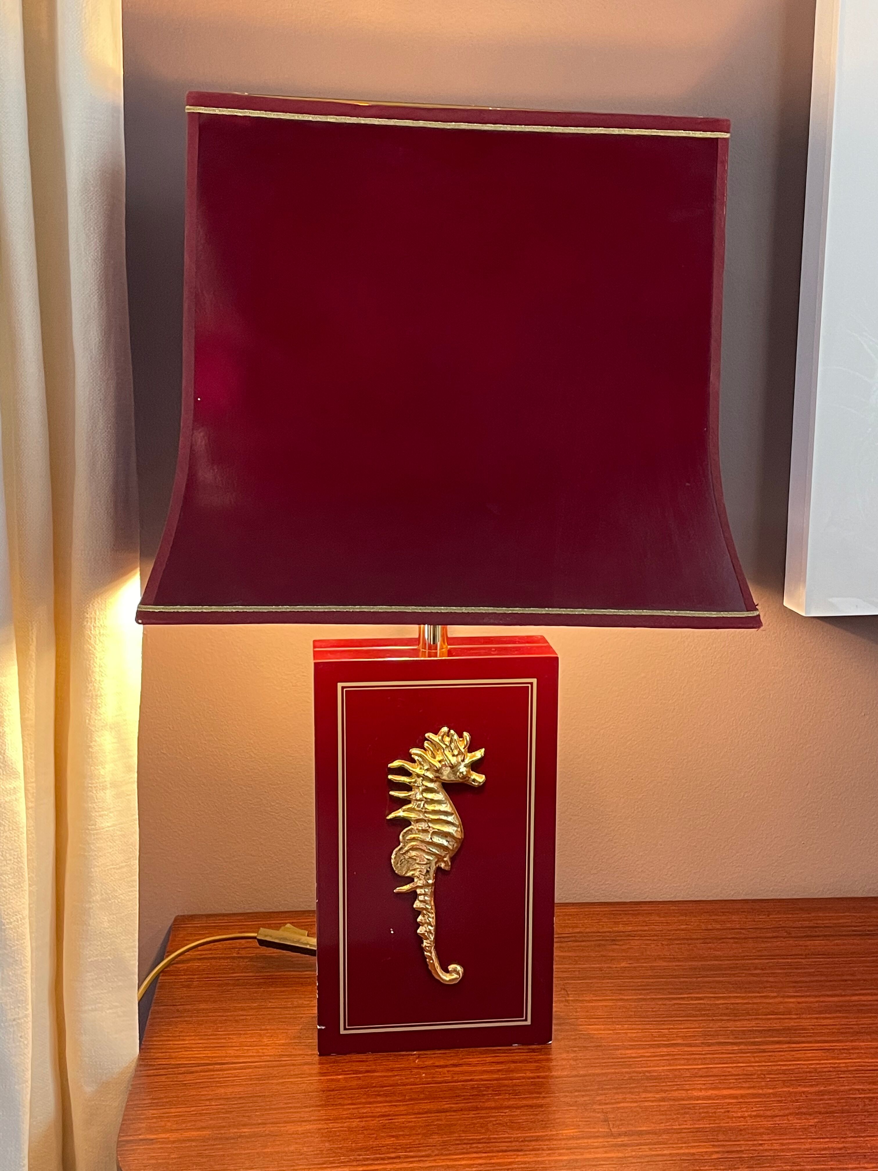 Pair of table lamps in Bordeaux lacquered wood and brass seahorse
