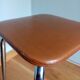 Caramel skaï stool and tapered feet in chrome metal