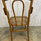 Curved wood and cane armchair