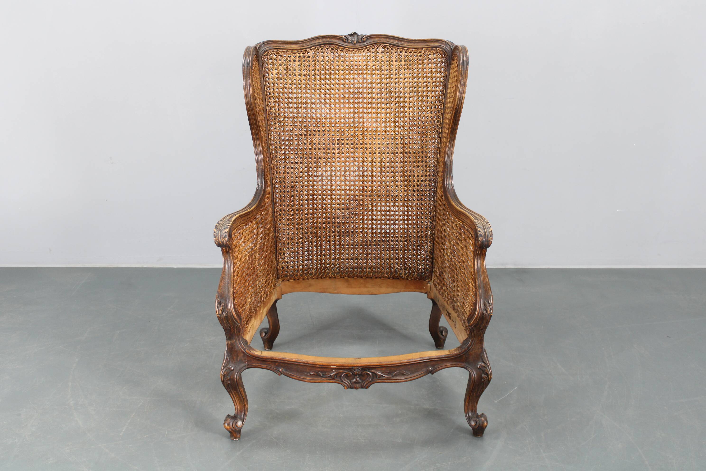 Antique Carved Wing Chair with Cane Sides , Czechoslovakia