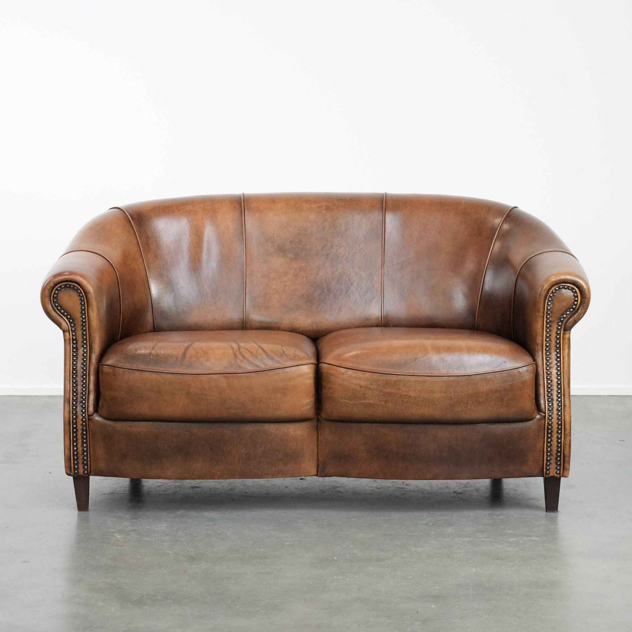 Characterful vintage sturdy 2-seater club sofa made of sheepskin leather