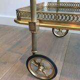 Neoclassical style rolling table in brass with blue glass tops