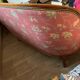Art Deco style sofa, covered in Indian fabric with a pink background