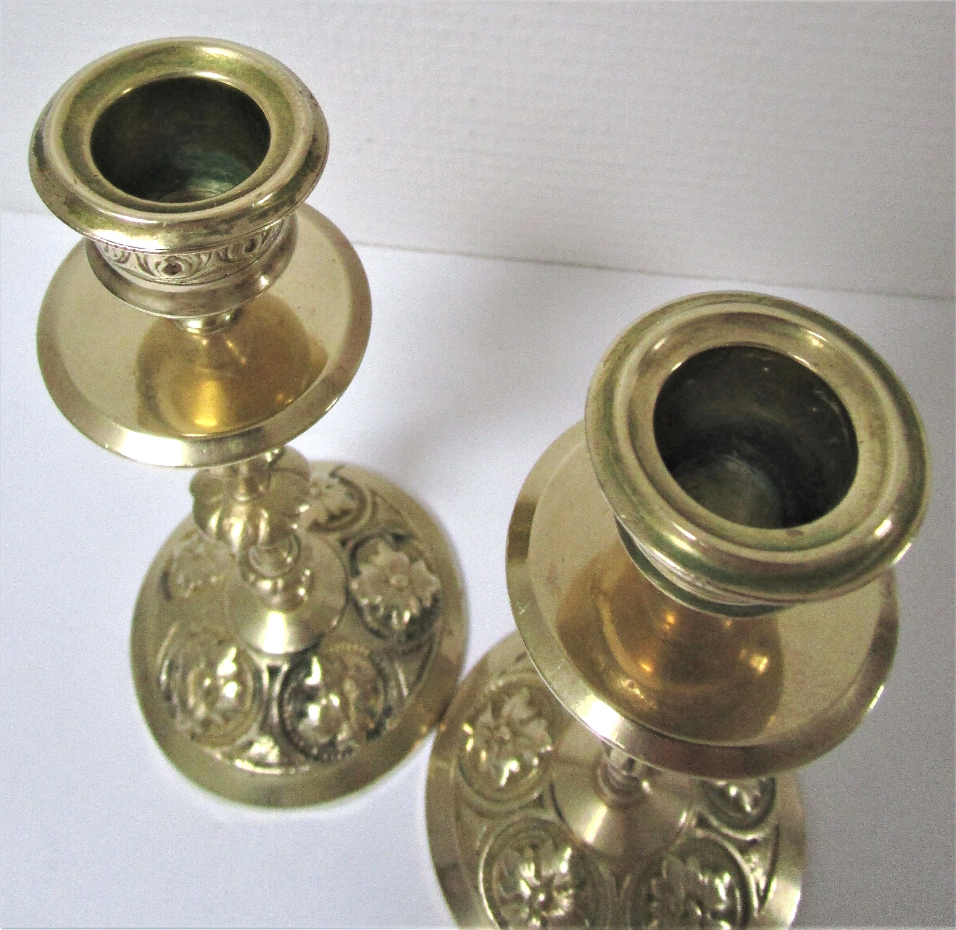Pair of vintage brass candlesticks decorated with flowers