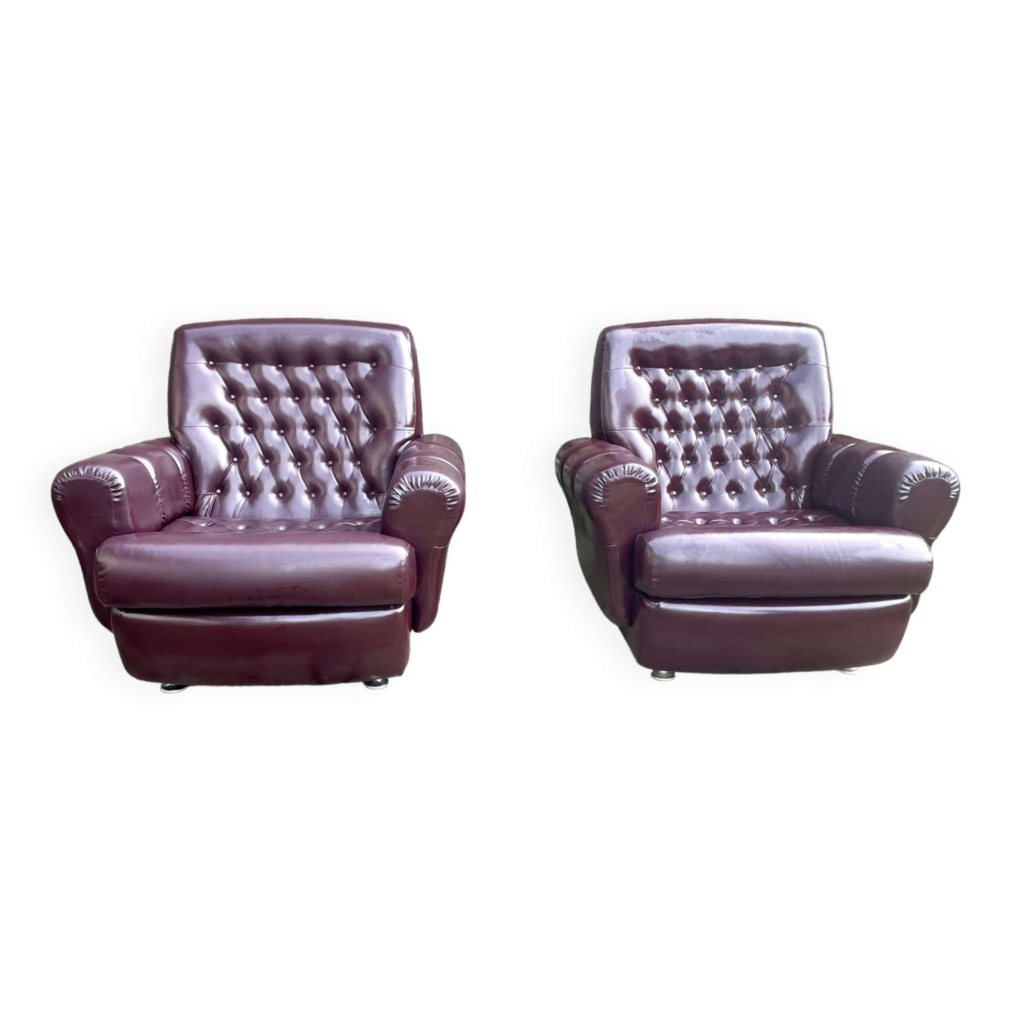 Pair of upholstered armchairs in aubergine imitation leather