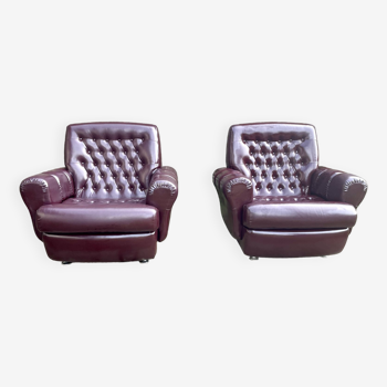 Pair of padded armchairs in aubergine leatherette