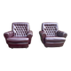 Pair of upholstered armchairs in aubergine imitation leather