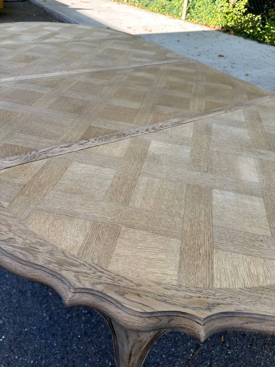Round extendable dining table Louis XV stripped in solid oak 1950