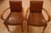 Pair of Art Deco armchairs in curved wood and brown leather – 1930s