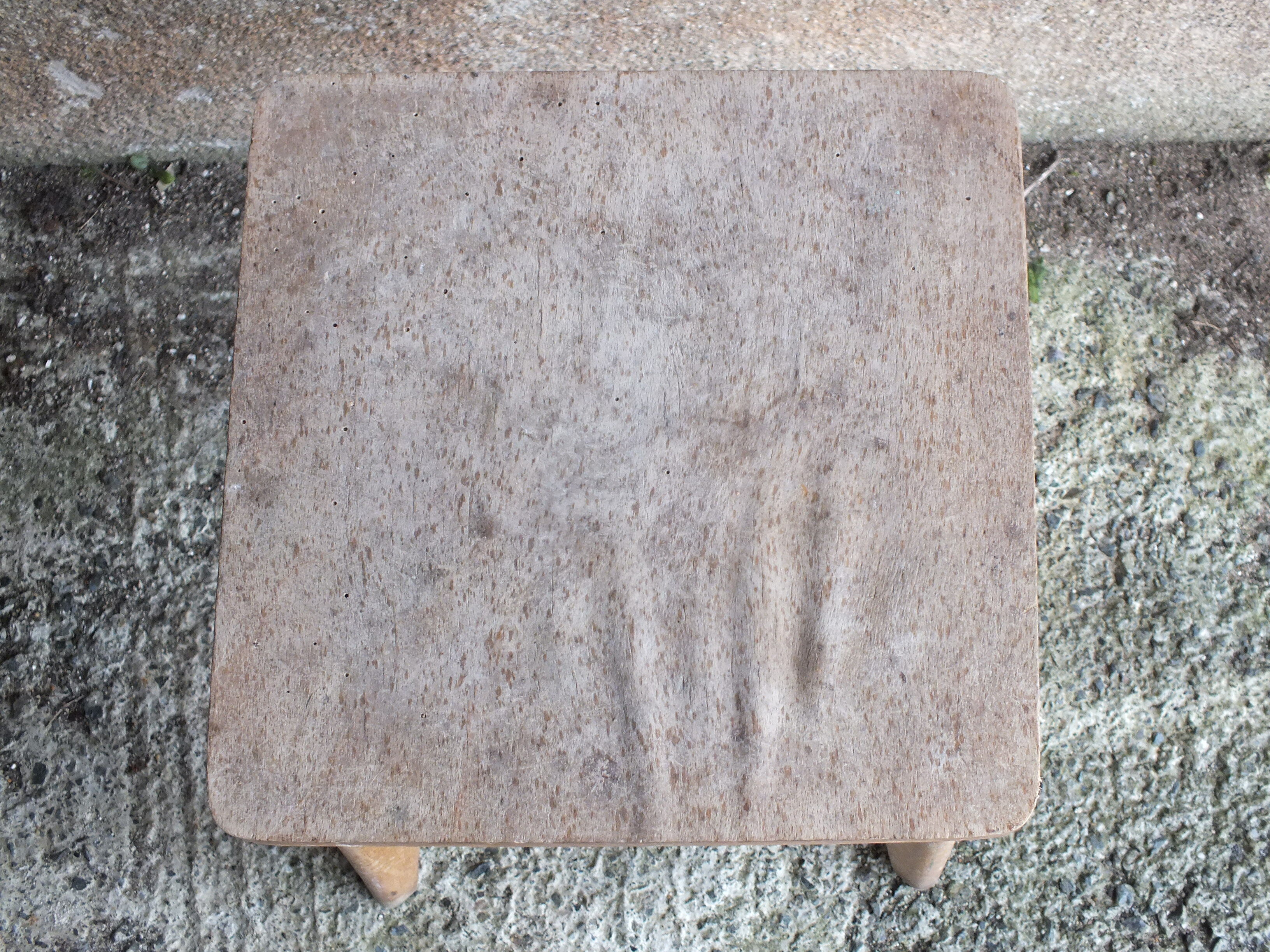 Vintage wooden stool with 4 legs from the 50s