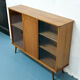 Console with sliding doors