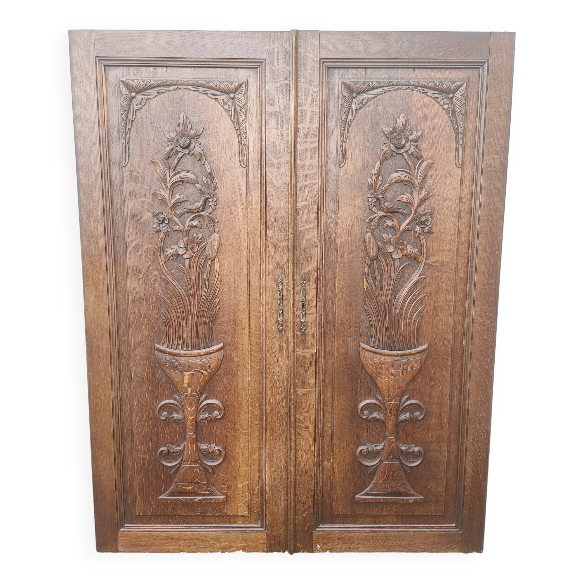pair of antique solid oak cabinet doors with bird decor