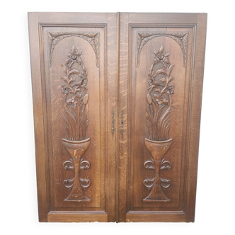 pair of antique solid oak cabinet doors with bird decor