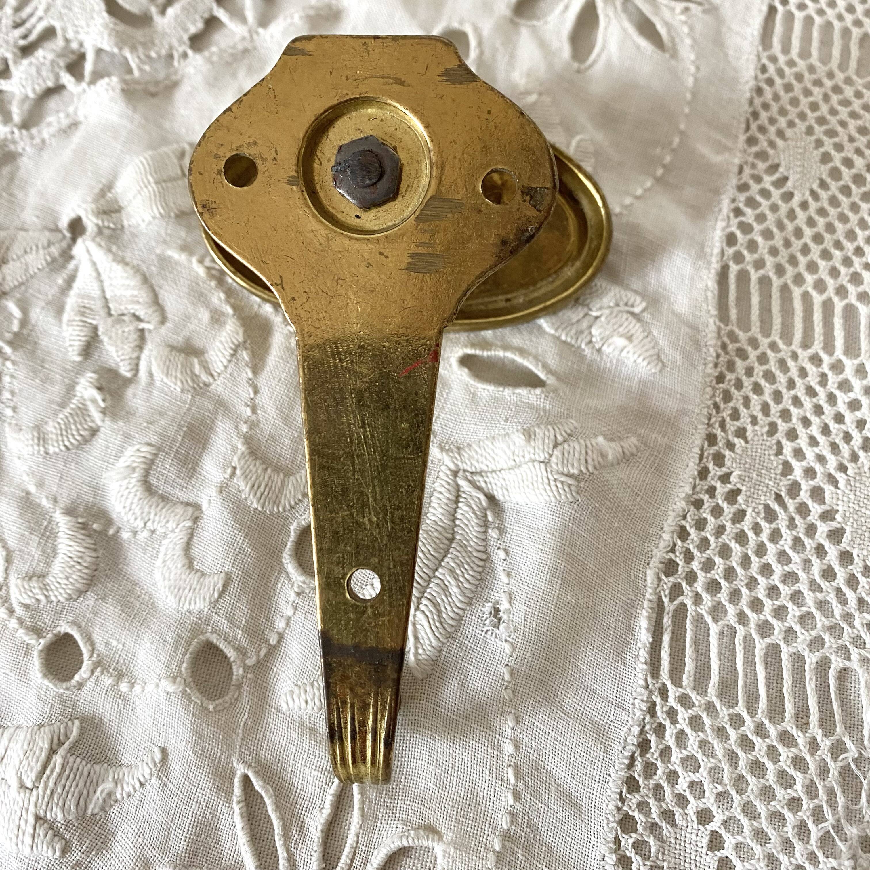 Golden brass coat hook