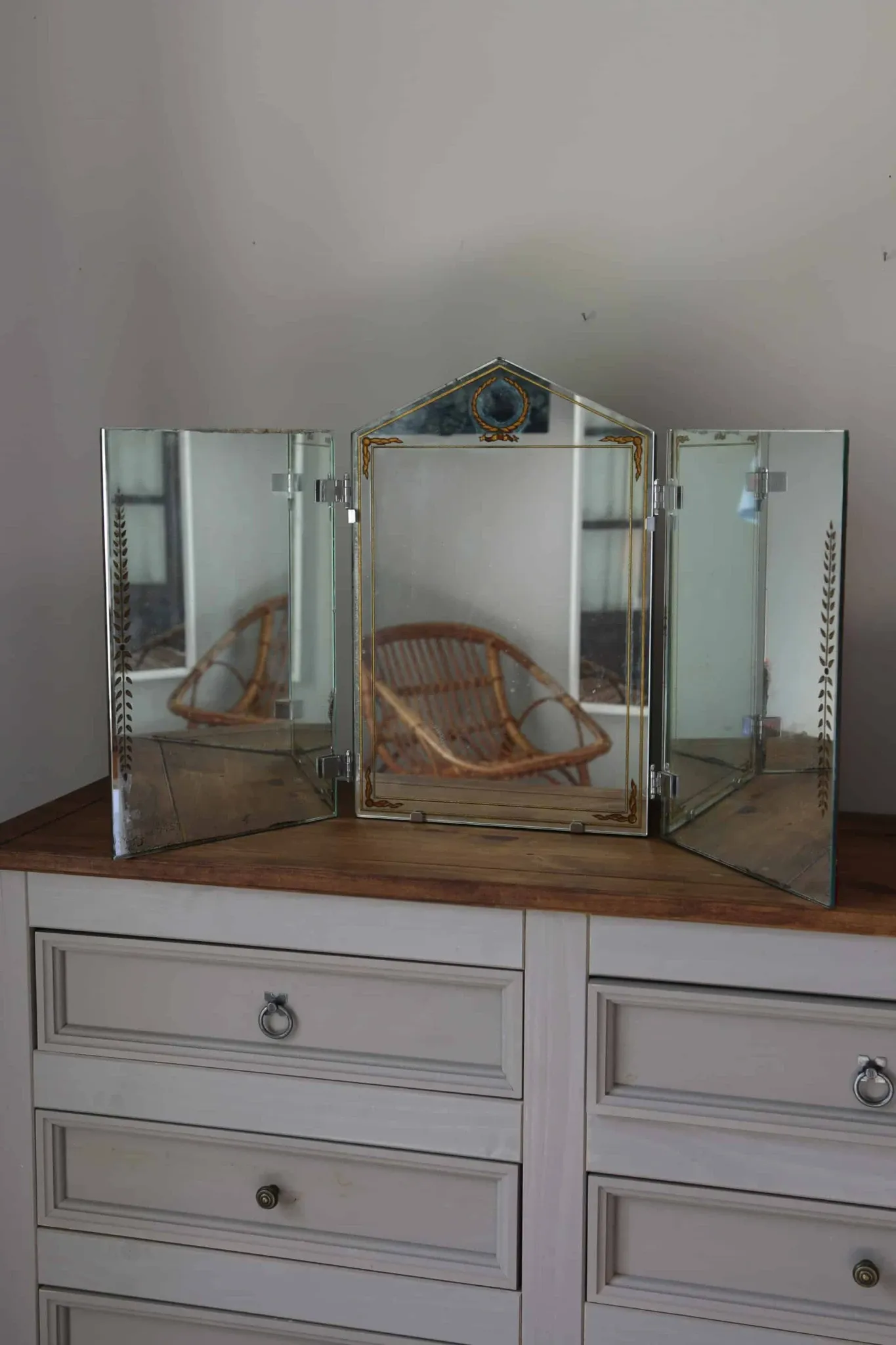 Triptych mirror with eglomisé and pediment, 1940s-50s