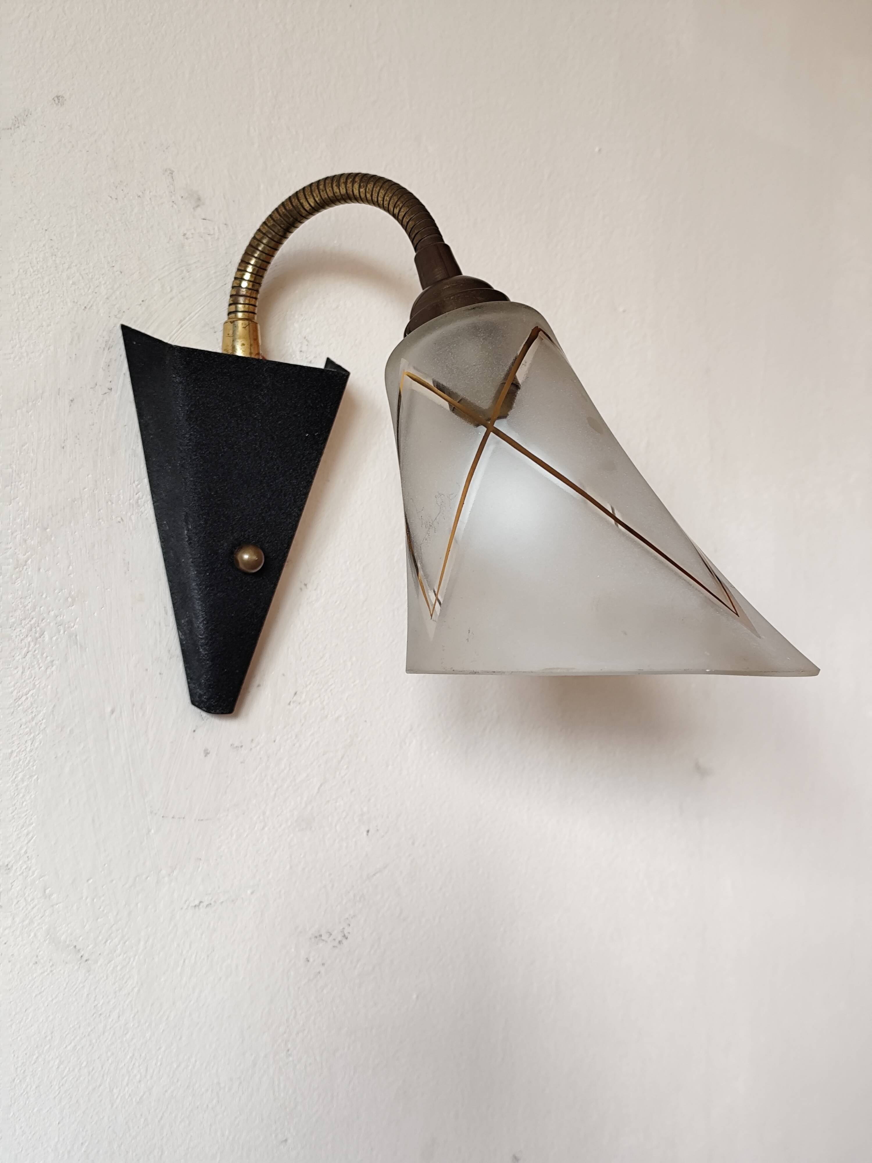 1950s wall lamp, metal, flexible brass stem and opaque shade.