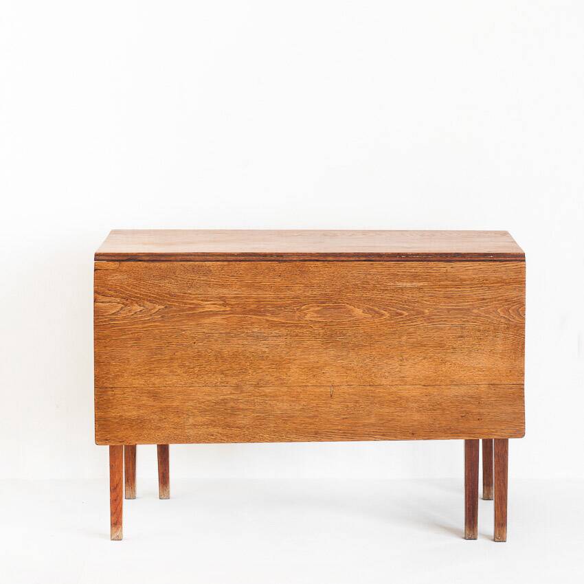 Vintage table with two folding leaves. Solid oak wood. France, 1940s