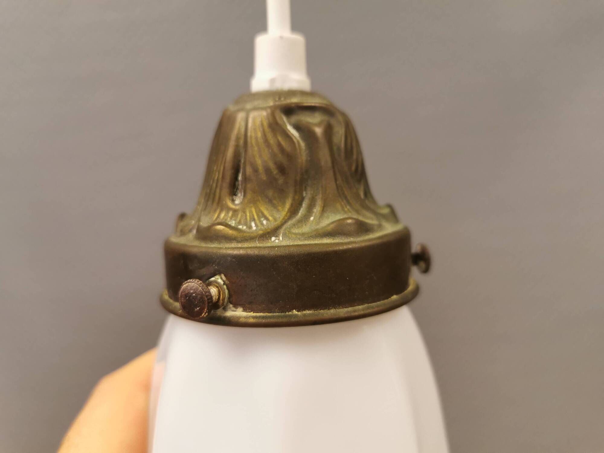 Small delicious tulip shaped hanging lamp in white opal glass with brass top.