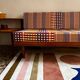 Peter Hvidt Knoll wooden banquette sofa with new cushions.