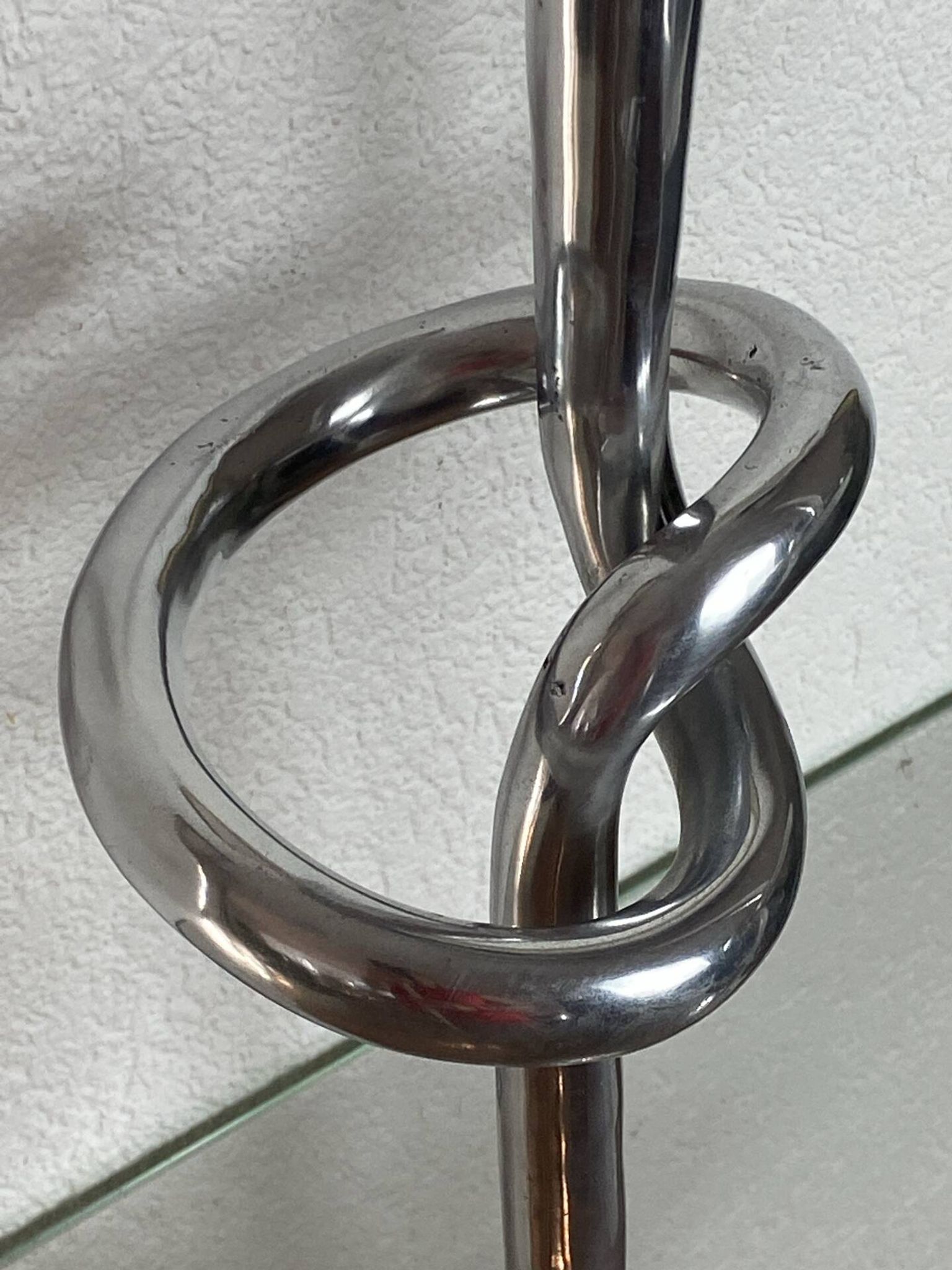 Pair of large aluminium bow candlesticks, Italy, 1970.