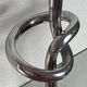 Pair of large aluminium bow candlesticks, Italy, 1970.