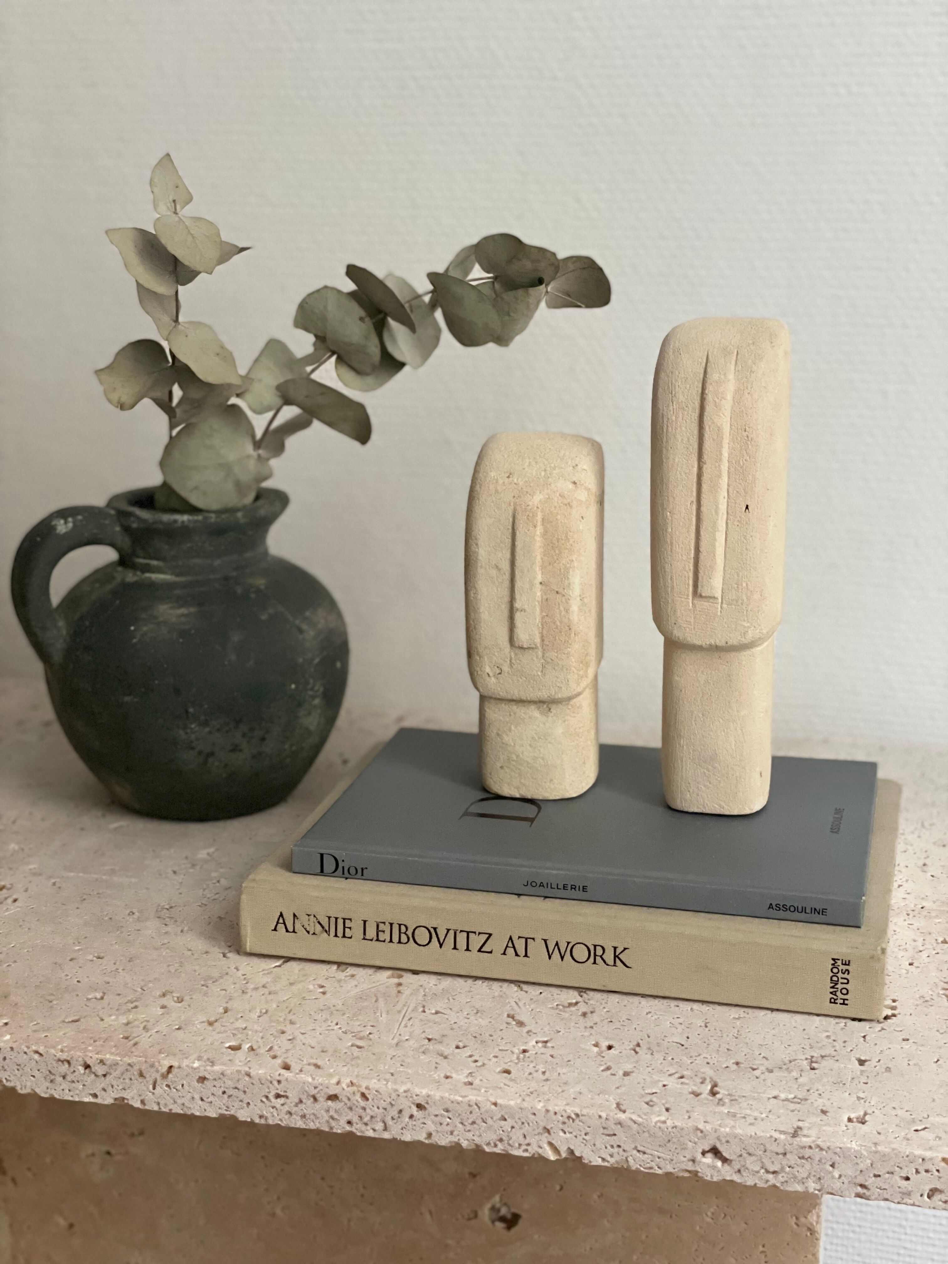 Set of two minimalist stone face statues