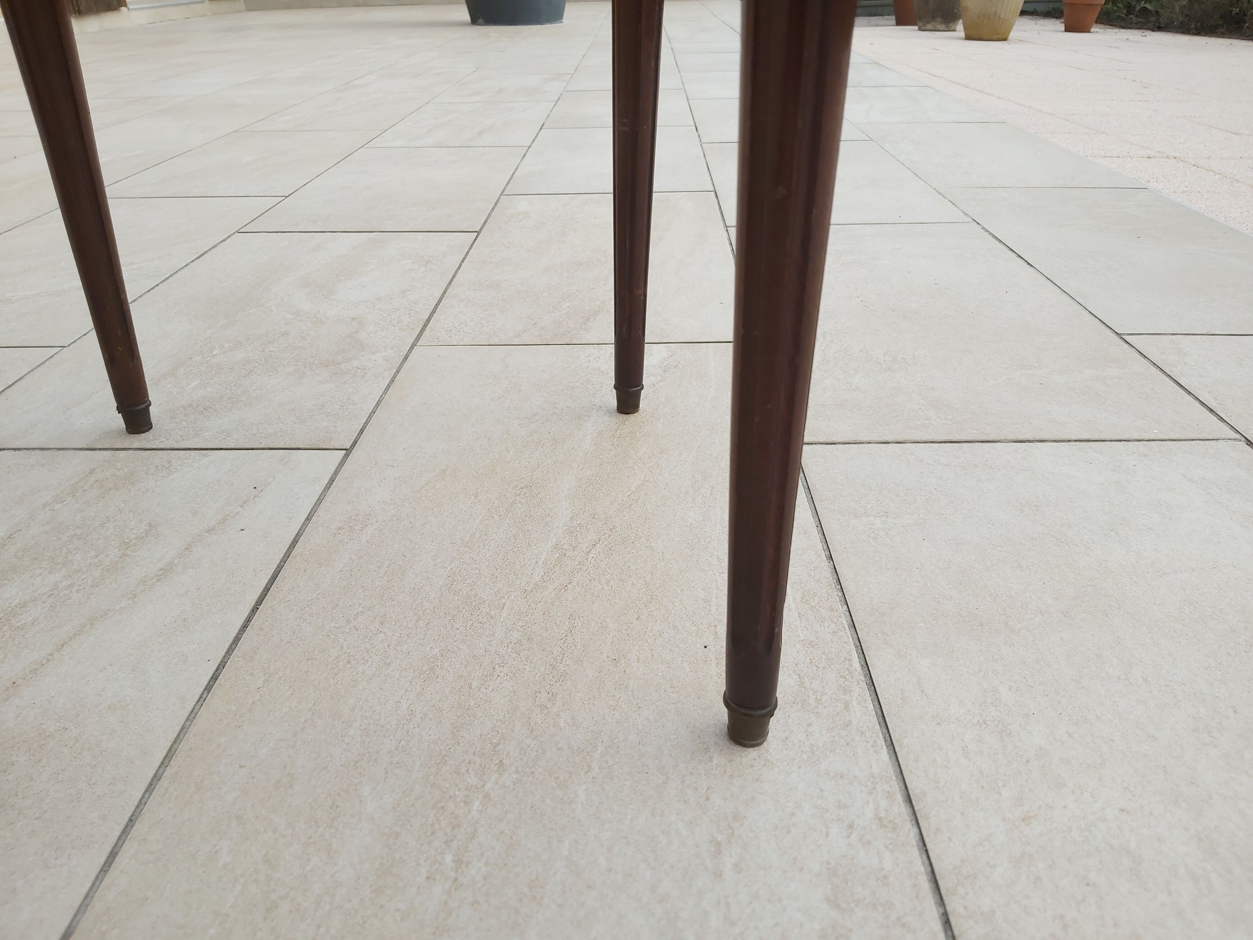 Gray marble mahogany pedestal table and brass gallery