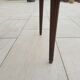 Gray marble mahogany pedestal table and brass gallery