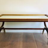Coffee table in patinated and gilded carved wood with mirror top