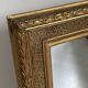 Small wooden mirror with gilded stucco in the Louis XVI style.