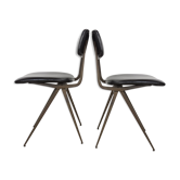 Pair of industrial style chairs in metal and faux black leather