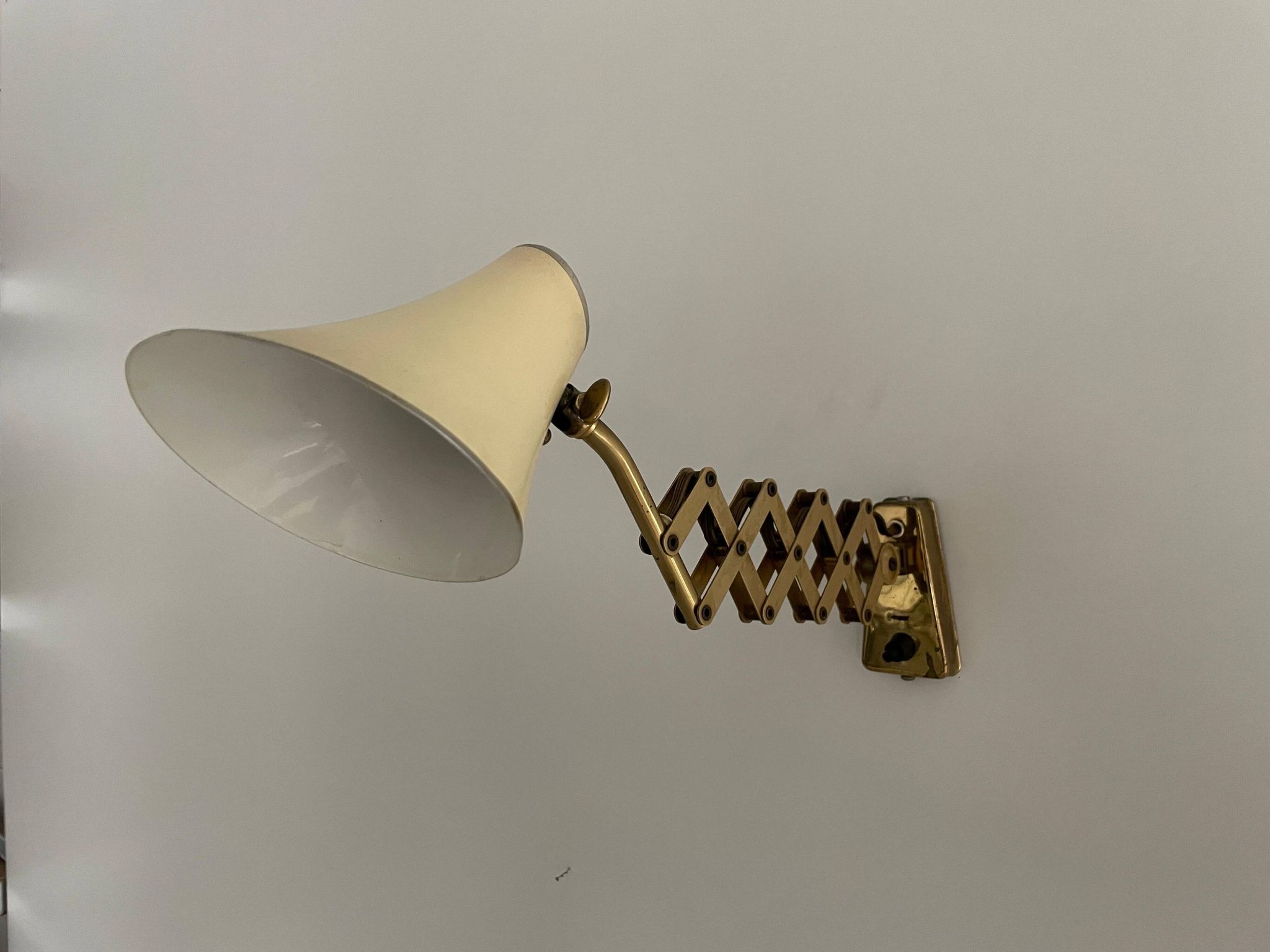 Cream metal and brass wall lamp with scissors design by Karl Lang for SIS Licht, 1950s, Germany.