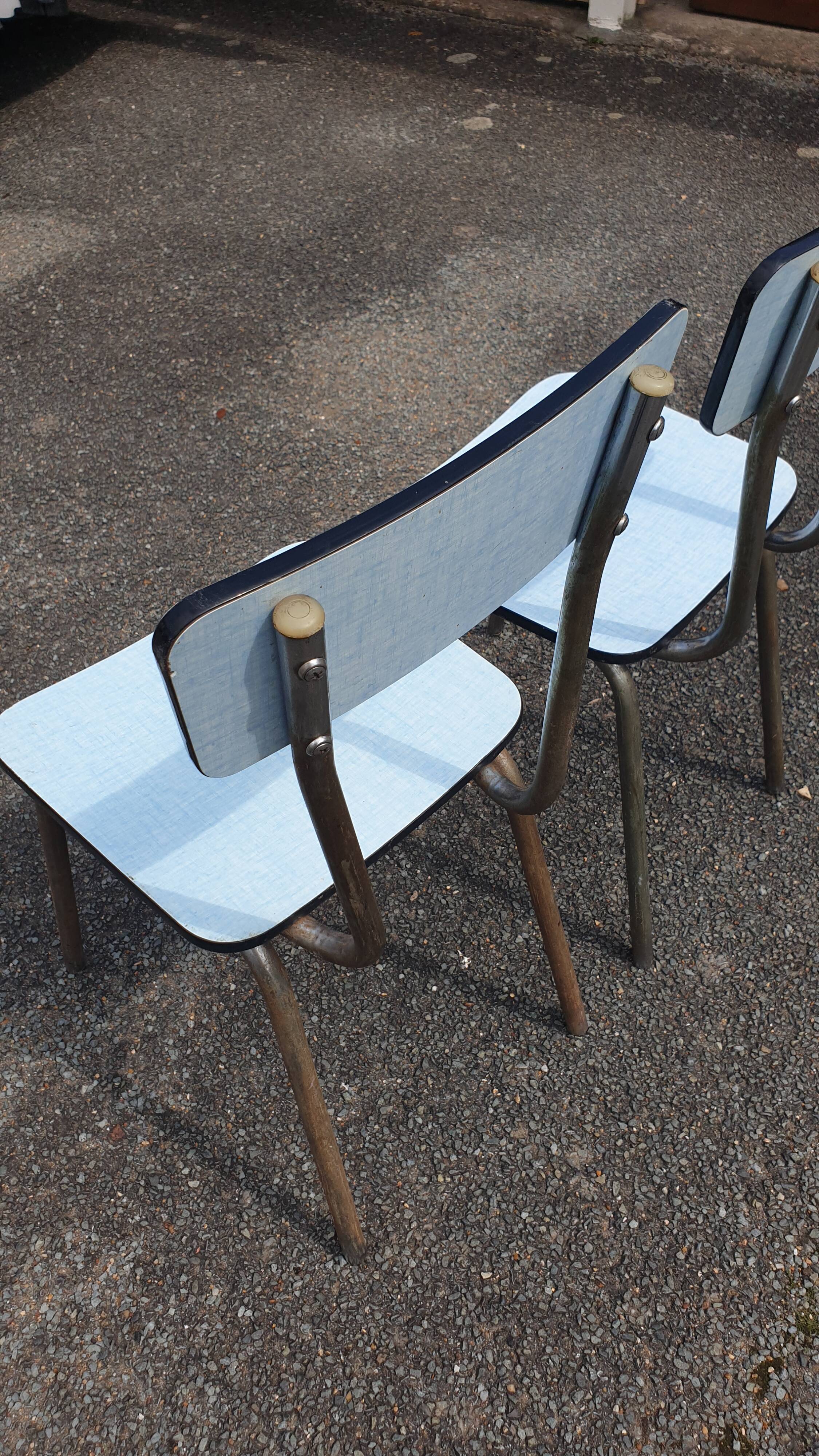 2 sky blue Formica chairs