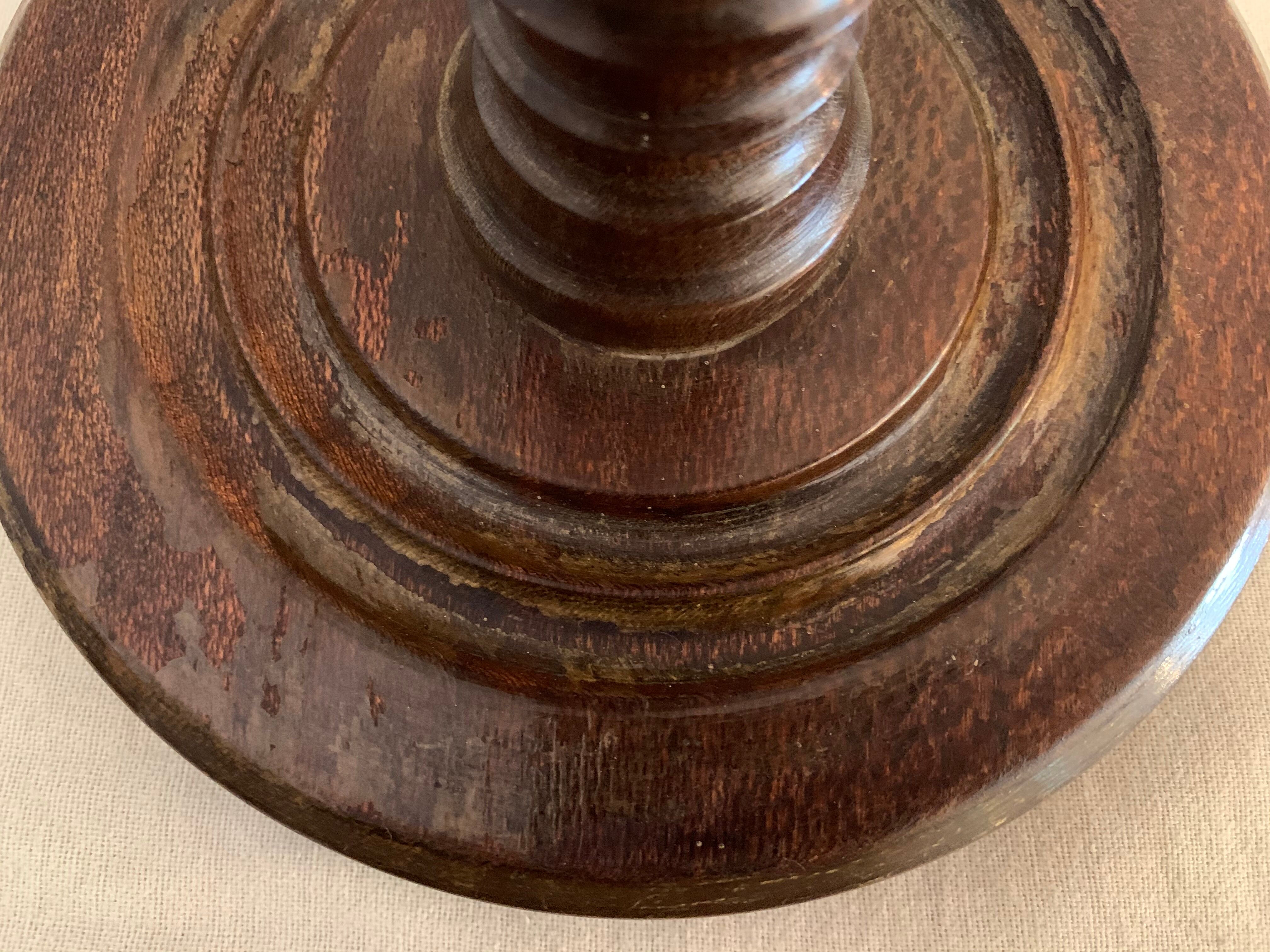 Turned wooden lamp foot in the shape of a warhead