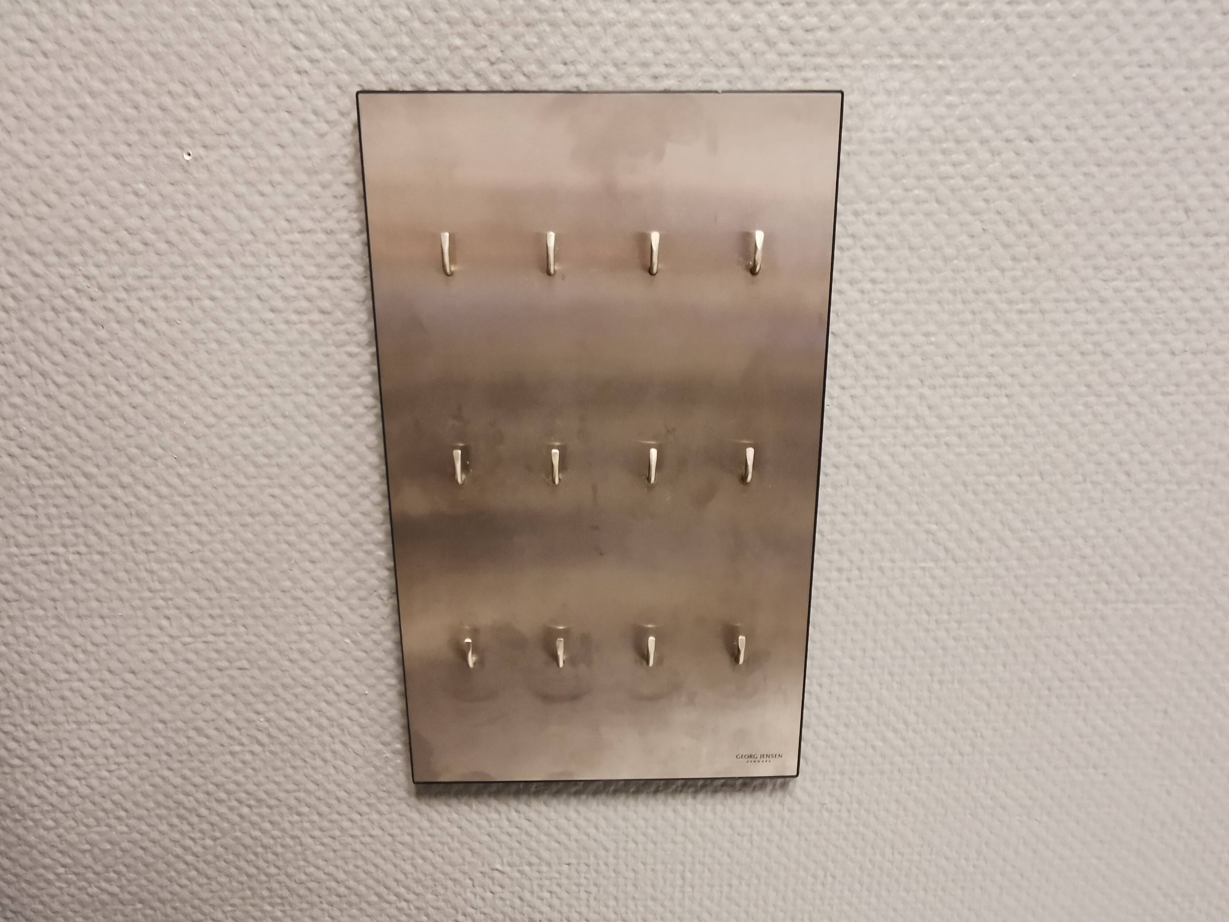 George Jensen key hanging board in brushed steel in classic Danish design.