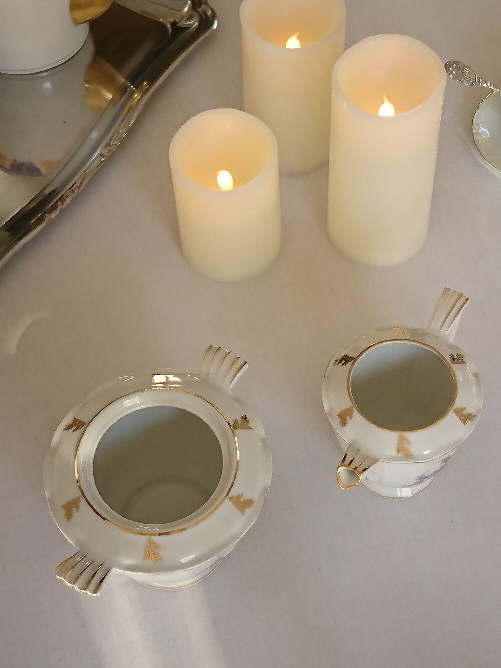 Sugar bowl and milk jar in flowery white porcelain