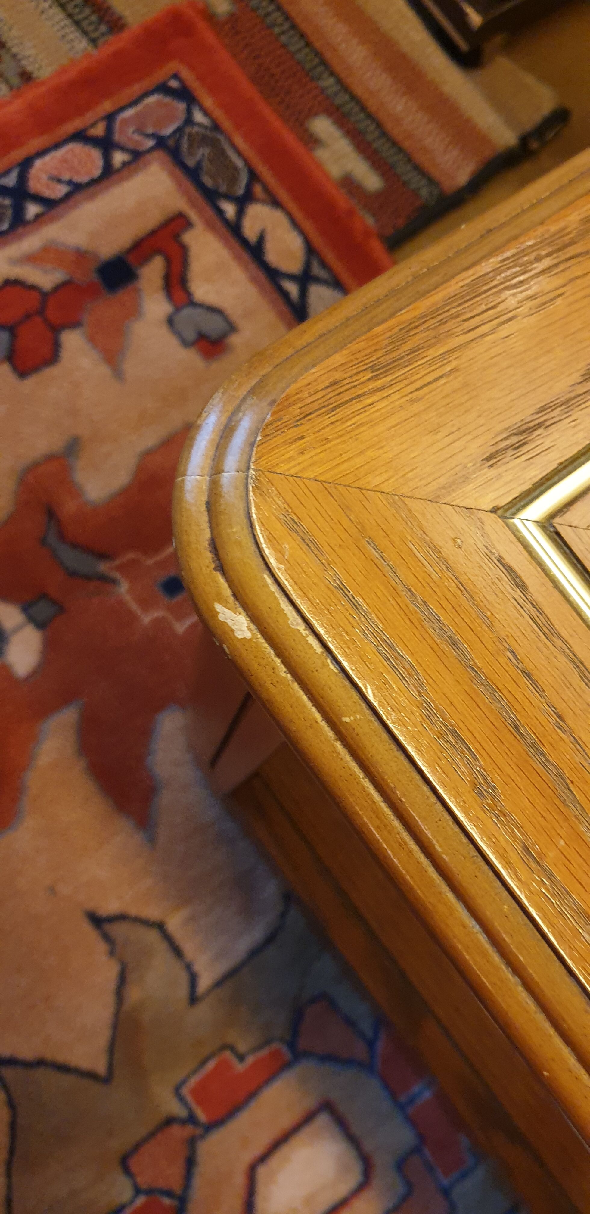Wood and glass coffee table on wheels