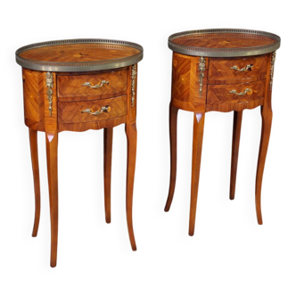 Pair of oval bedside tables in marquetry from the 20th century.