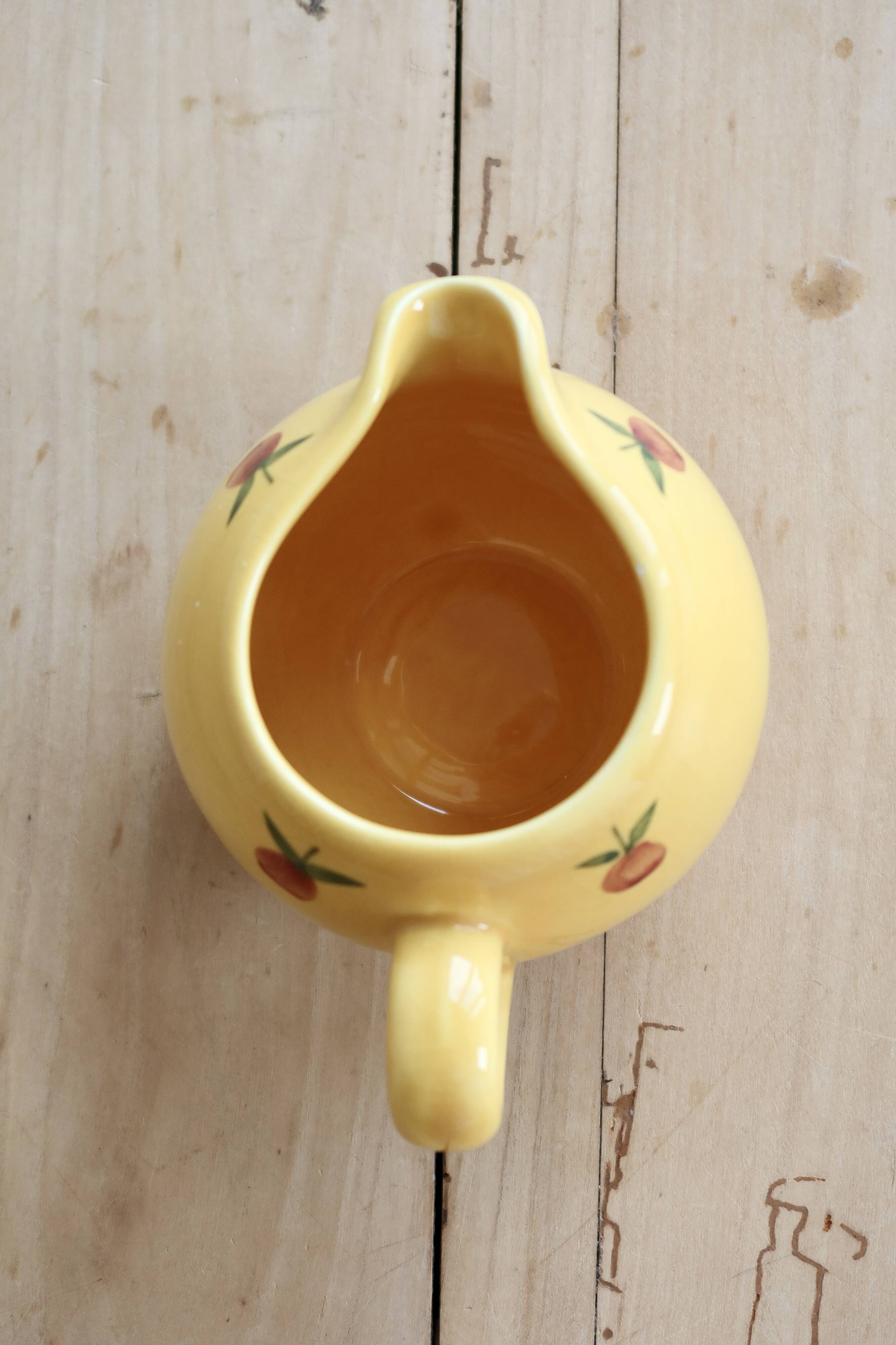 Vintage yellow ceramic milk jug