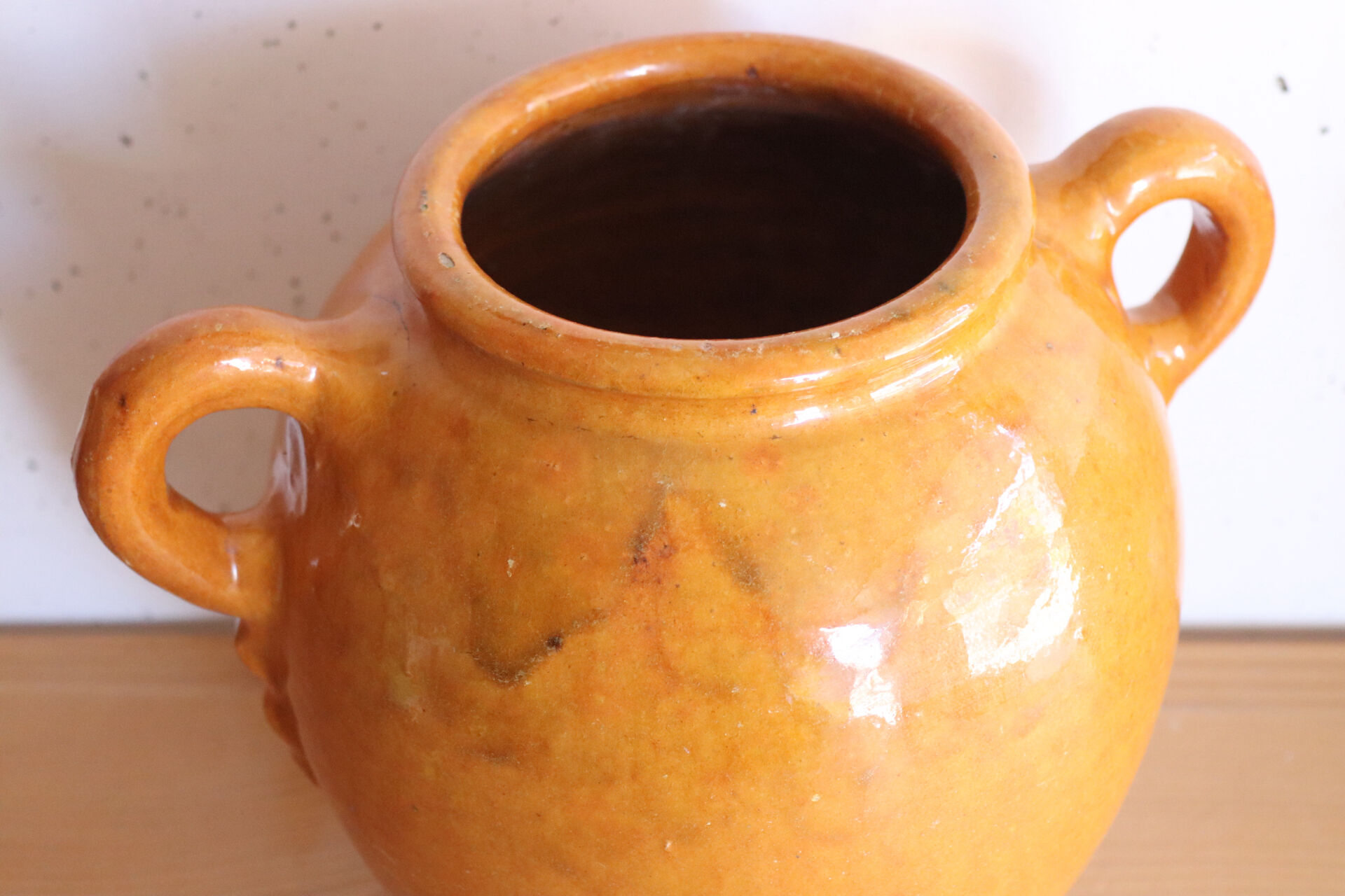 Old honey-glazed pot with two handles