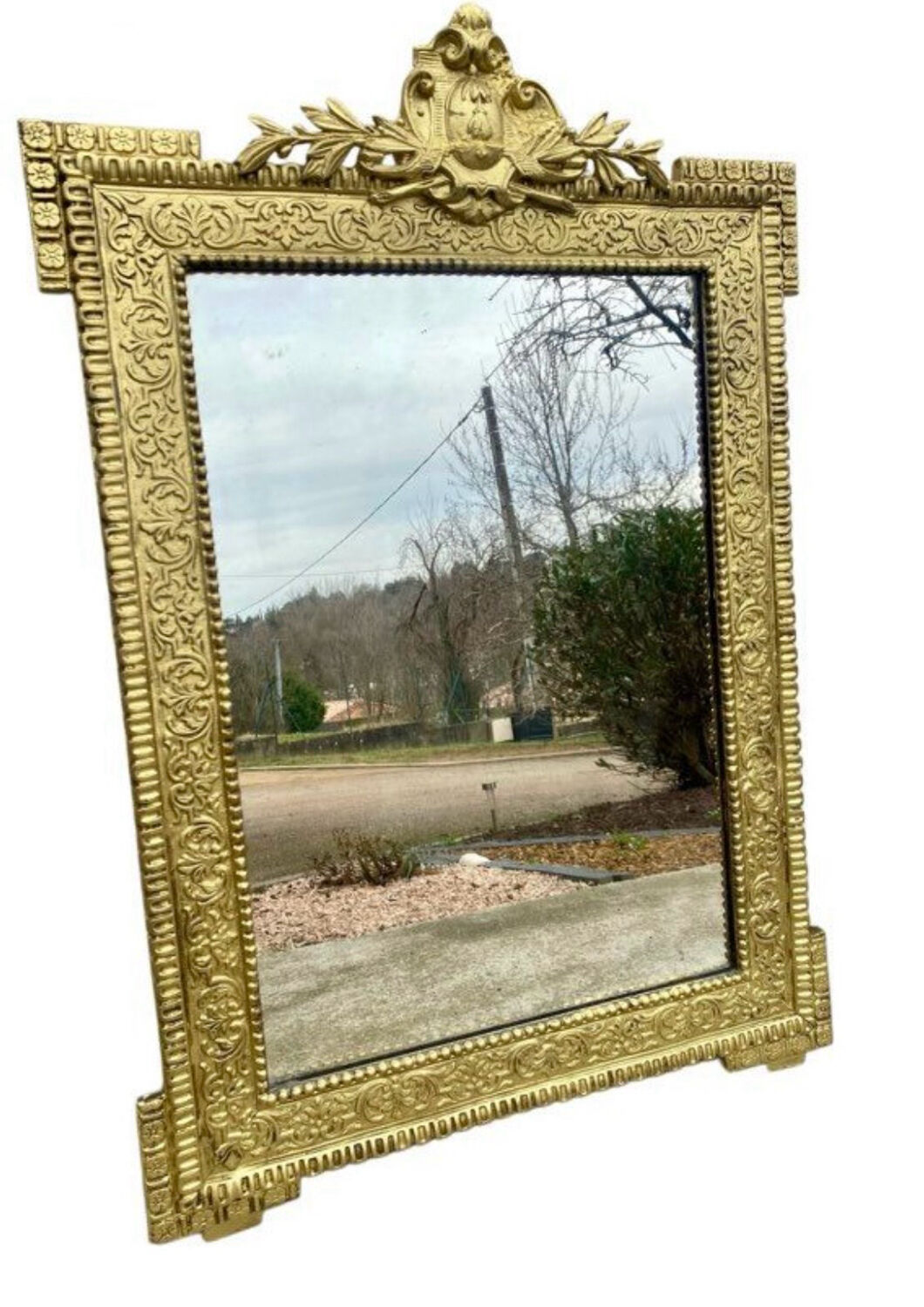 19th-century antique mirror in carved gilded wood, Napoleon style.