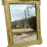 19th-century antique mirror in carved gilded wood, Napoleon style.