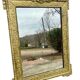 19th-century antique mirror in carved gilded wood, Napoleon style.