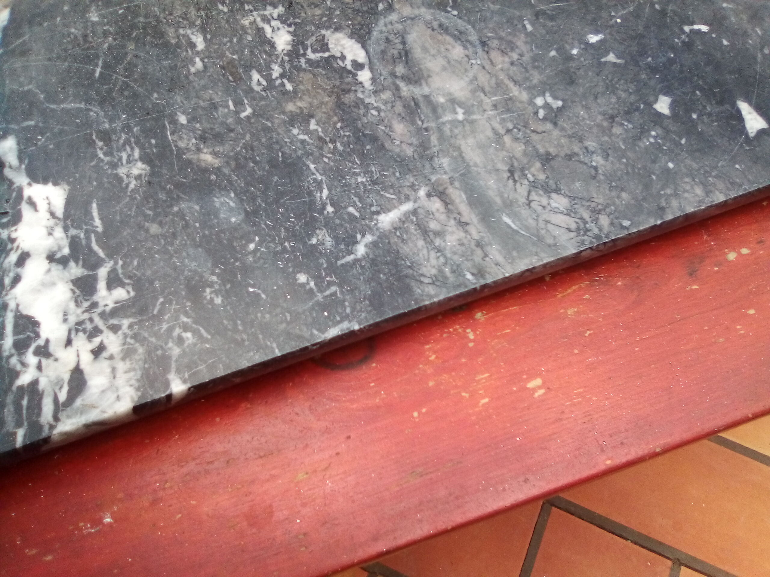 White veined black marble fireplace