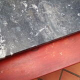 White veined black marble fireplace