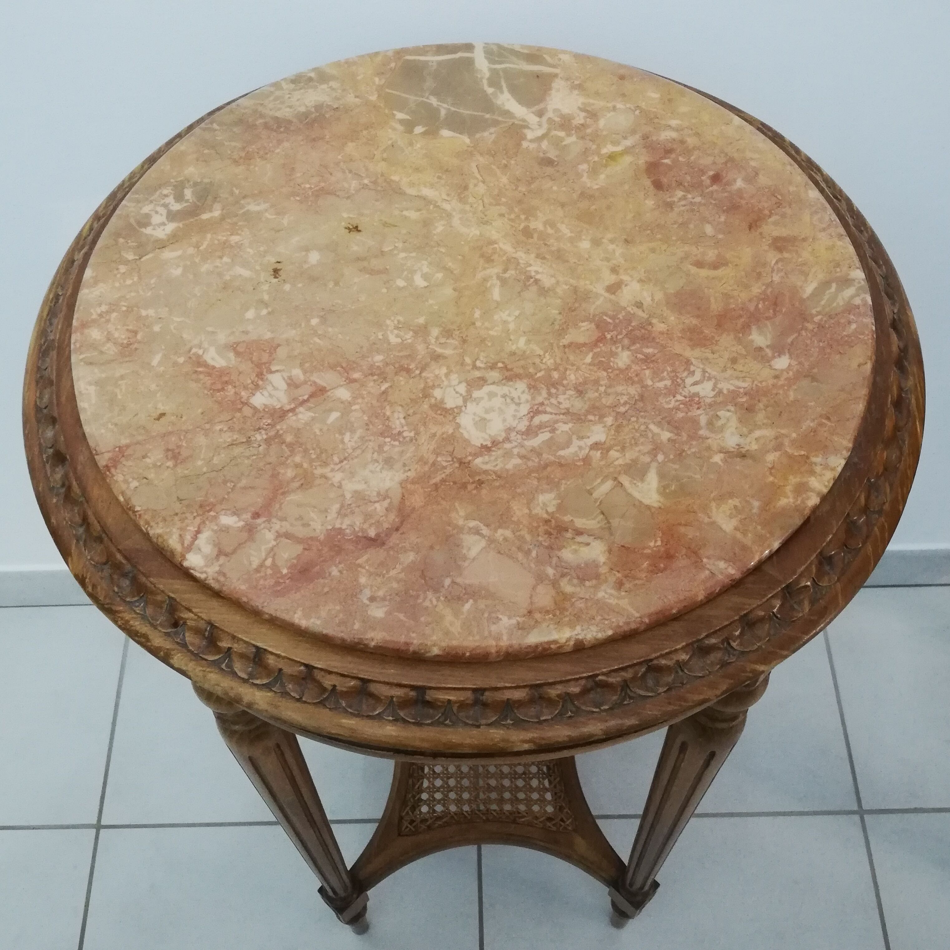 Wooden pedestal table carved in the Louis XVI style