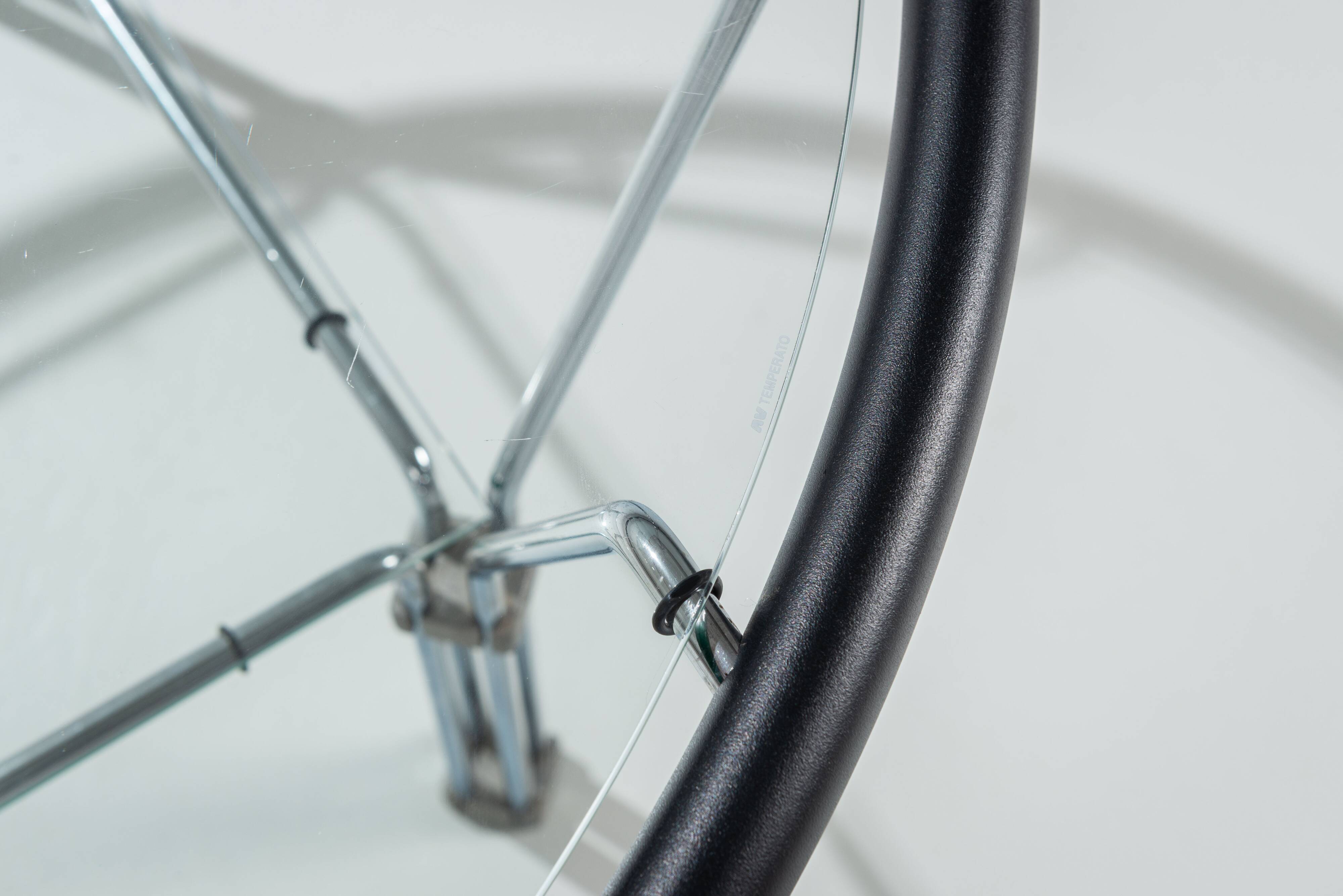 Post-Modern round glass and steel coffeetable attributed to Niels Bendtsen